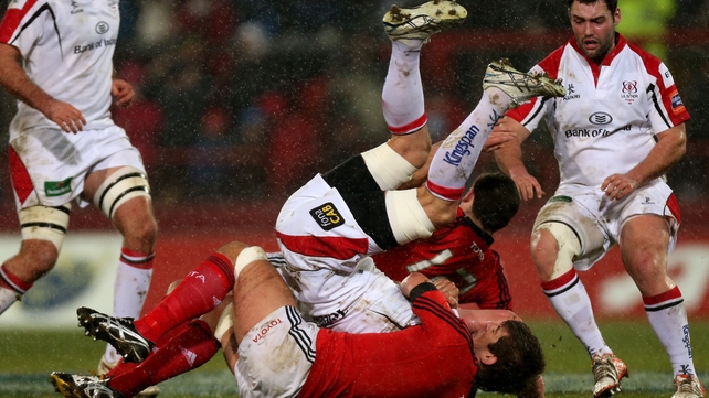Munster's Donncha O'Callaghan and James Downey get to grips with Ulster's Robbie Diack