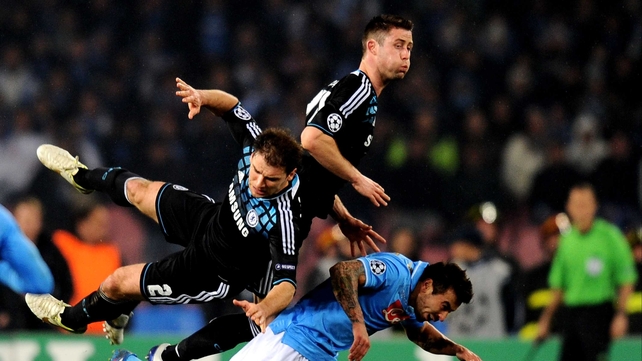 Branislav Ivanovic (L) and Gary Cahill combine to foil a Napoli attack in the Champions League