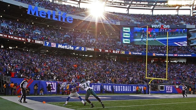 Too little, too late: The New York Giants' Rueben Randle catches a touchdown pass during the win at Metlife Stadium, but his side's indifferent form during the regular season means they miss the play-offs
