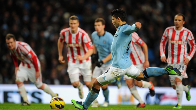 Sergio Aguero of Manchester City scores from a penalty against Stoke