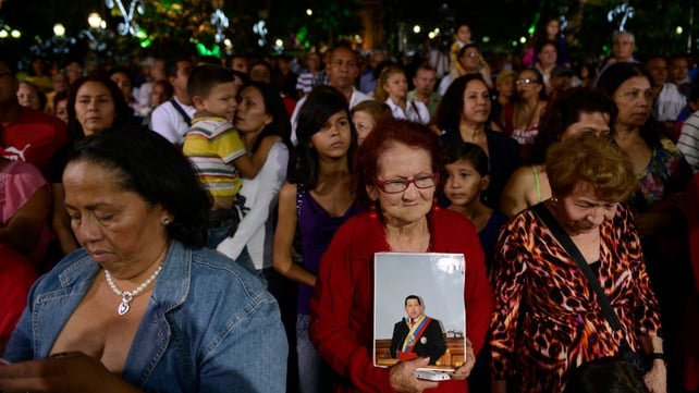 Supporters of Hugo Chavez pray during a mass in Caracas on 31 December Supporters of Hugo Chavez pray during a mass in Caracas on 31 December