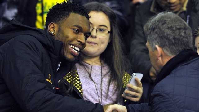 Daniel Sturridge is greeted by a fan at Anfield last night