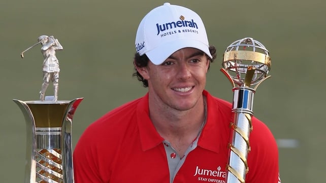 Rory McIlroy shows off the season-ending DP World Tour Championship and The Race to Dubai trophies