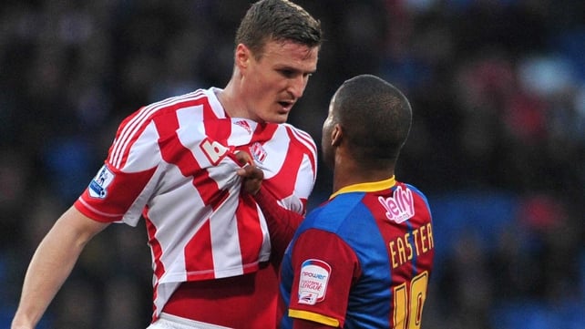 Crystal Palace's Welsh striker Jermaine Easter (R) clashes with Stoke's Robert Huth