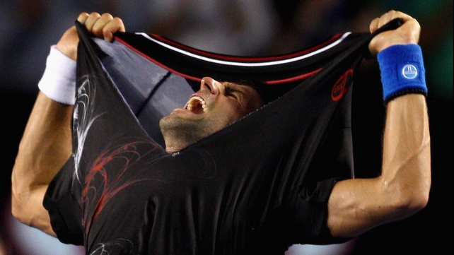 Novak Djokovic reacts after defeating Rafa Nadal in last year's epic final