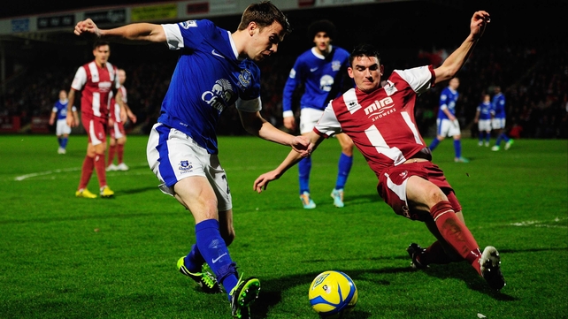 Seamus Coleman of Everton is faced by Billy Jones of Cheltenham Town
