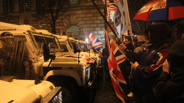 Police were out in force as loyalists demonstrated outside Belfast City Hall last night