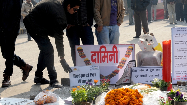 Indian activists stand near a memorial to a rape victim during a protest in New Delhi Indian activists stand near a memorial to a rape victim during a protest in New Delhi