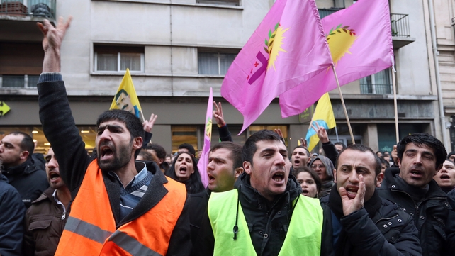 Hundreds of people, including Kurds, gathered on the street near the scene of the murders Hundreds of people, including Kurds, gathered on the street near the scene of the murders