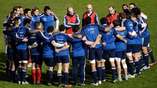 France's head coach Philippe Saint-Andre (centre right) talks to his team alongside assistant coaches Yannick Bru (centre left) and Patrice Lagisquet (centre)