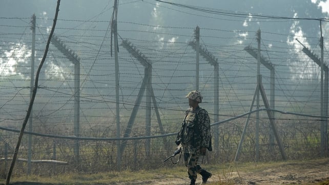 An Indian soldier patrols the border with Pakistan An Indian soldier patrols the border with Pakistan