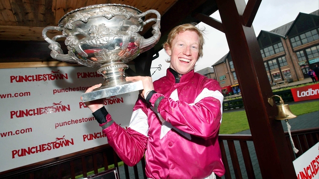 Mikey Fogarty holds aloft the Conyngham Cup after his victory aboard Panther Claw