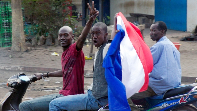Malian people wave a French flag in Bamako as France send troops to help Malian forces hold back an advance by Islamist rebels Malian people wave a French flag in Bamako as France send troops to help Malian forces hold back an advance by Islamist rebels