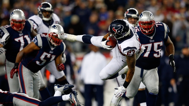 Arian Foster gets knocked off his feet as his team the Houston Texans were eliminated from the NFL play-offs