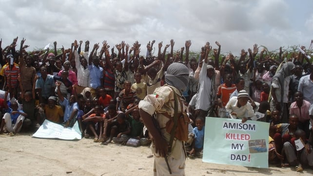 Somali men carry weapons during a demonstration organised by the islamist Al-Shabaab group Somali men carry weapons during a demonstration organised by the islamist Al-Shabaab group