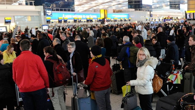 Passengers queue at for the check-in desks at Heathrow airport after hundreds of flights were cancelled Passengers queue at for the check-in desks at Heathrow airport after hundreds of flights were cancelled