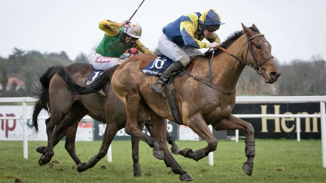 A mud-covered Abbey Lane outstays his rivals in the Boylesports Hurdle