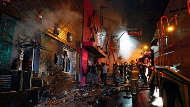 Firefighters try to put out the fire at a nightclub in Santa Maria Firefighters try to put out the fire at a nightclub in Santa Maria