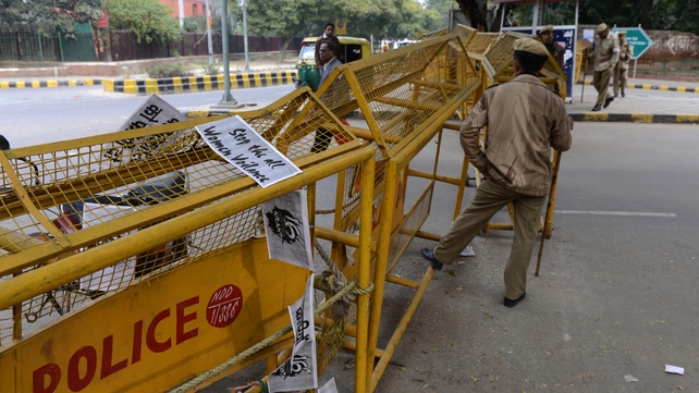 Anti-rape posters draped on a police barricade in New Delhi Anti-rape posters draped on a police barricade in New Delhi
