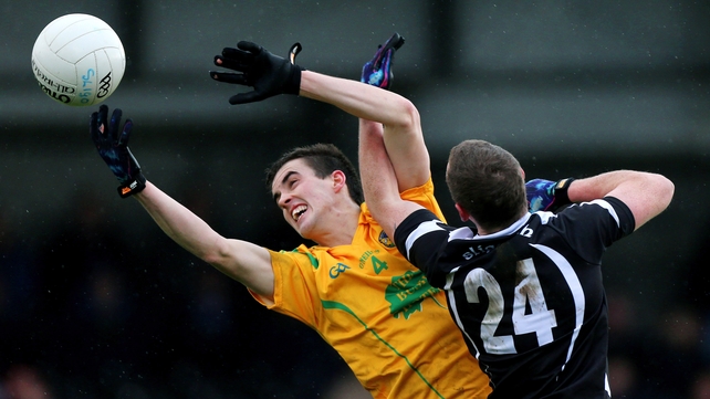 Paddy Maguire of Leitrim makes a catch despite the attentions of Sligo's Adrian Marren
