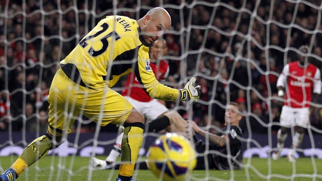 Theo Walcott's effort goes past Pepe Reina to draw Arsenal level
