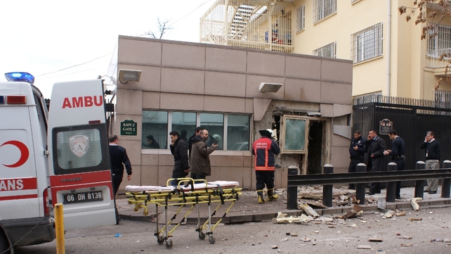 Television footage showed a door blown out and masonry from the wall around it scattered in front of the side entrance Television footage showed a door blown out and masonry from the wall around it scattered in front of the side entrance