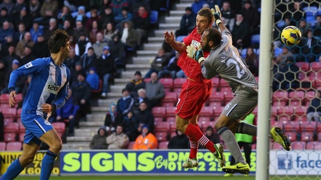 Rickie Lambert gets in ahead of Wigan keeper Ali Al Habsi to score for Southampton at the DW Stadium