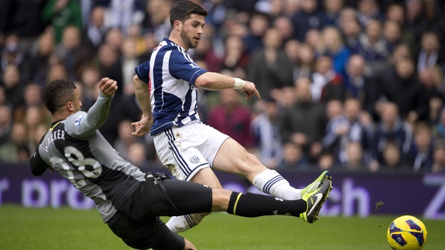 Ireland international Shane Long gets a shot away under pressure from Tottenham Hotspur defender Kyle Walker