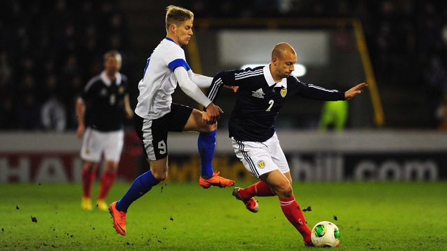 Scotland's Alan Hutton comes under pressure from Tarmo Kink