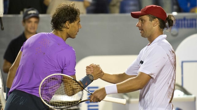 Rafael Nadal shakes hands with his vanquisher Horacio Zeballos