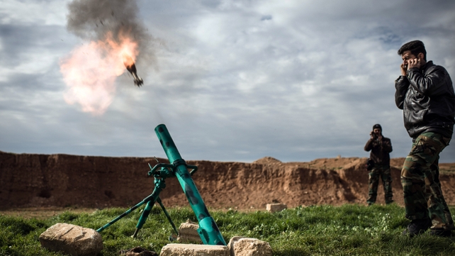 Syrian rebels fire a mortar towards regime forces stationed at Kwiriss airport in Al-Bab Syrian rebels fire a mortar towards regime forces stationed at Kwiriss airport in Al-Bab