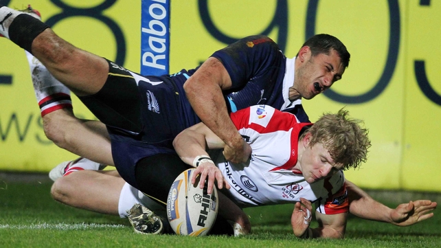 Chris Cochrane is just prevented from scoring a try in the corner as Richard Fussell forces him into touch