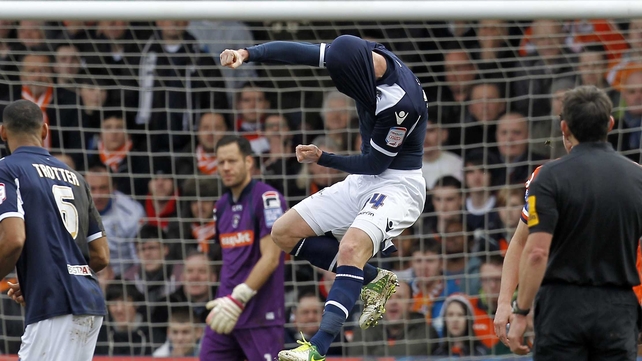 Millwall midfielder James Henry (c) celebrates his opener