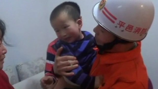 After the girl was handed back into her mother's arms by fire-fighters, she said "thank you" to her rescuers After the girl was handed back into her mother's arms by fire-fighters, she said "thank you" to her rescuers
