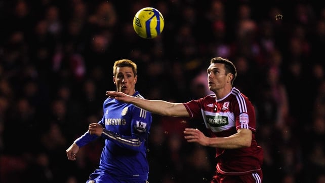 Chelsea player Fernando Torres is challenged by Boro defender Stephen McManus