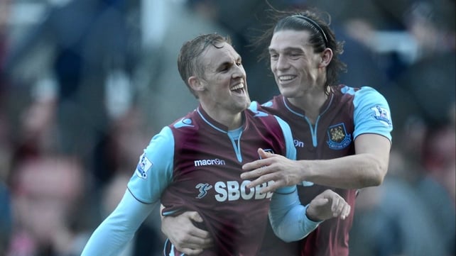 Jack Collison celebrates with Andy Carroll after his first-half strike against Stoke