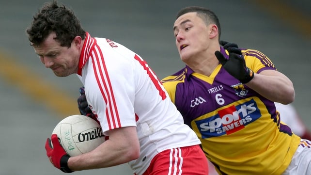 Barry McGoldrick of Derry and Wexford's Lee Chin