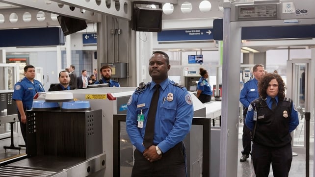 TSA staff at a security point in Chicago's O'Hare Airport TSA staff at a security point in Chicago's O'Hare Airport