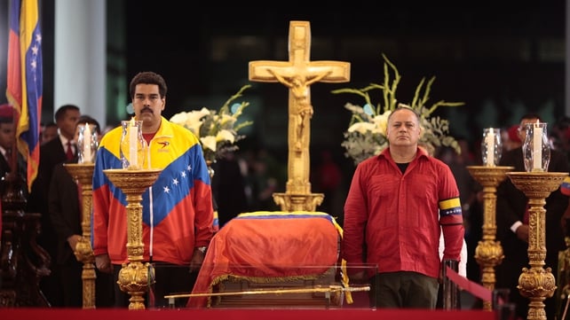 Vice President Nicolas Maduro (left) stands beside the coffin of Hugo Chavez at the military academy in Caracas