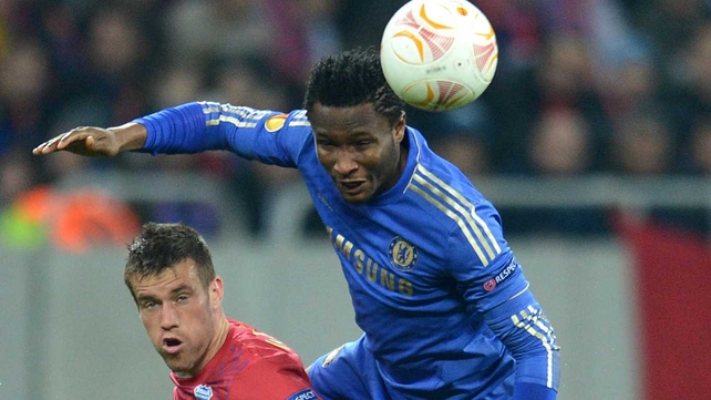 John Obi Mikel (r) of Chelsea fights for the ball with Mihai Doru Pintilii of Steaua Bucharest
