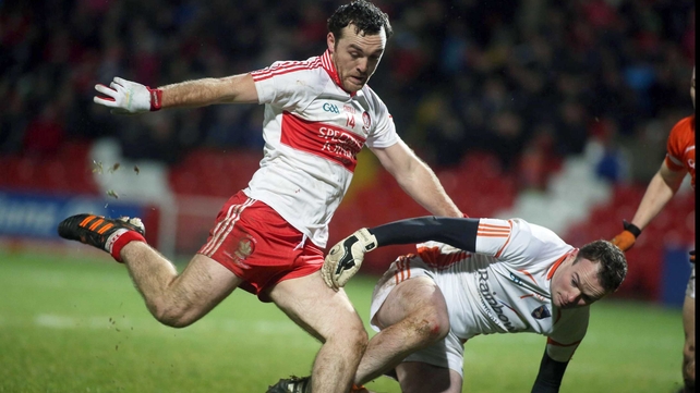 Derry's Emmet McGuckin and Armagh goalkeeper Philip McEvoy
