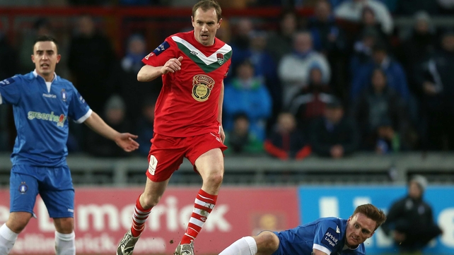 Cork's Colin Healy with Craig Curran of Limerick
