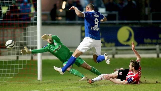 Sligo's Anthong Elding opens the scoring despite the effort of Derry's Gerard Dohertry and Ryan McBride