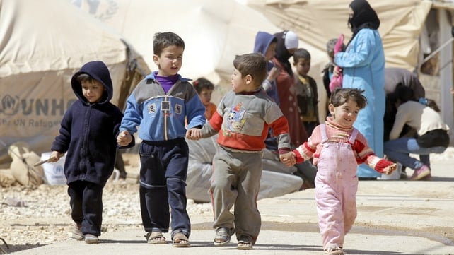 Syrian children walk amid tents at the Zaatari refugee camp, near the Syrian border with Jordan Syrian children walk amid tents at the Zaatari refugee camp, near the Syrian border with Jordan