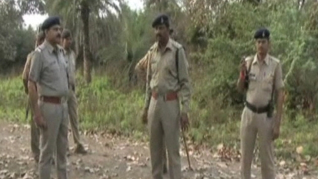 Police say at least eight men attacked the woman and her husband in a forest Police say at least eight men attacked the woman and her husband in a forest