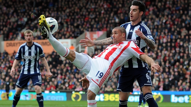 Ireland international Jonathan Walters is well marshalled by West Brom's Liam Ridgewell