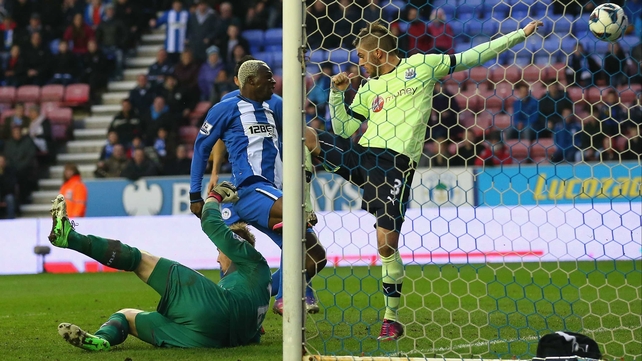Arouna Kone grabbed a controversial late winner as Wigan maintained their push for Premier League survival
