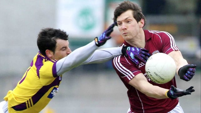 Graeme Molloy of Wexford tackles Galway's Michael Meehan