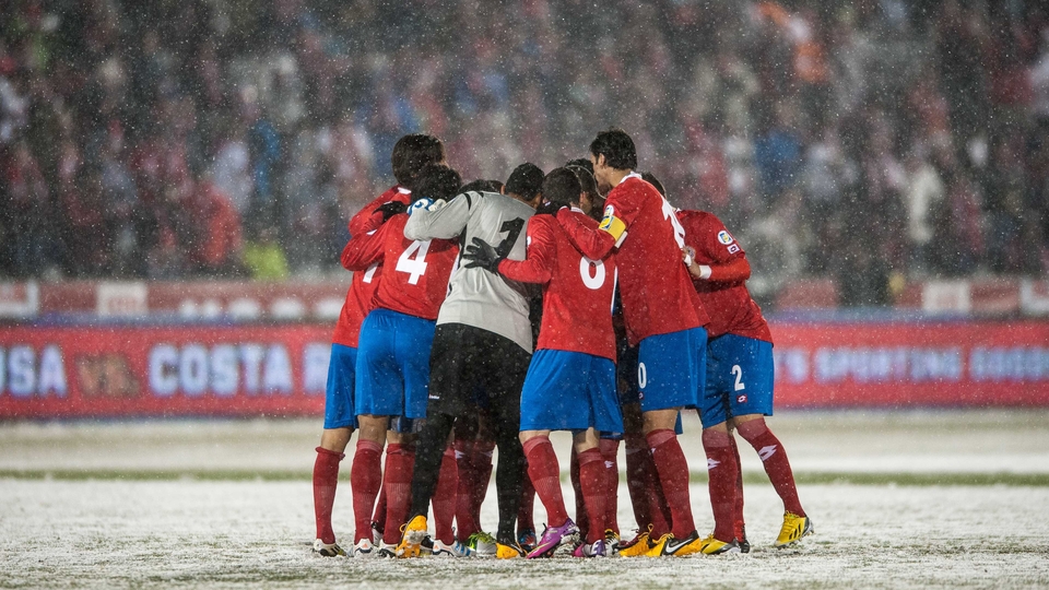 Costa Rica's players enter a huddle, possibly for warmth as much as anything else, at Dick's Sporting Goods Park