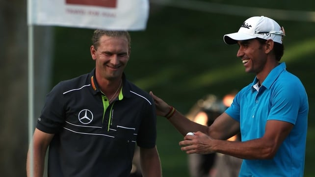 Marcel Siem of Germany is congratulated by Rafa Cabrera-Bello after holing his bunker shot on the 18th hole at the Hassan II Trophy in Morocco
